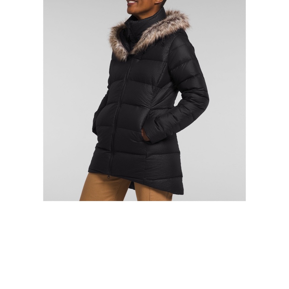 Woman’s NorthFace winter coat.